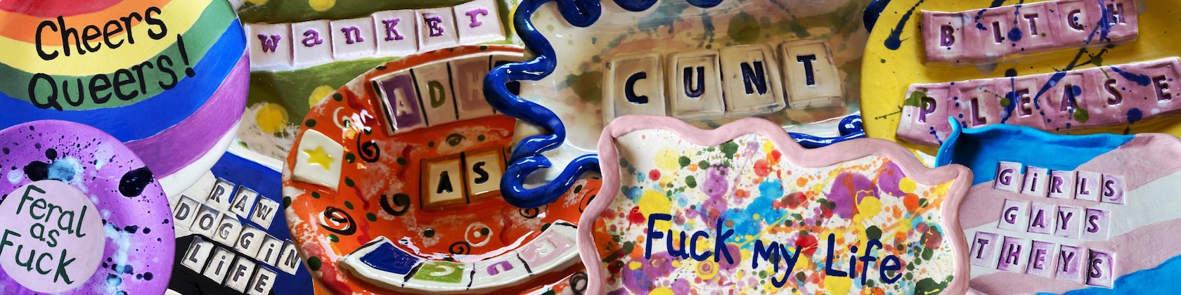 A colourful collection of Ange’s hand-built slogan pots